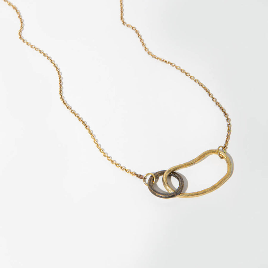 Two metals pair to create an unexpected blend of organic and graphic shapes.