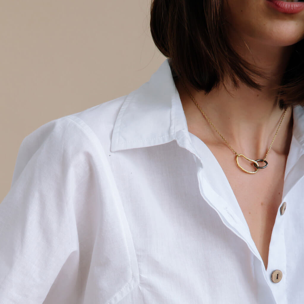 Two metals pair to create an unexpected blend of organic and graphic shapes.