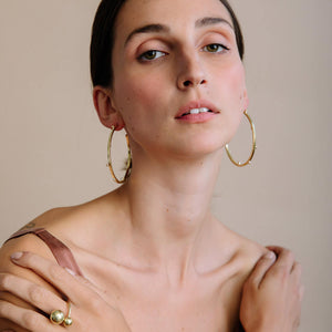 Dramatic brass hoop earrings. Ethically made jewelry designed for the everyday.