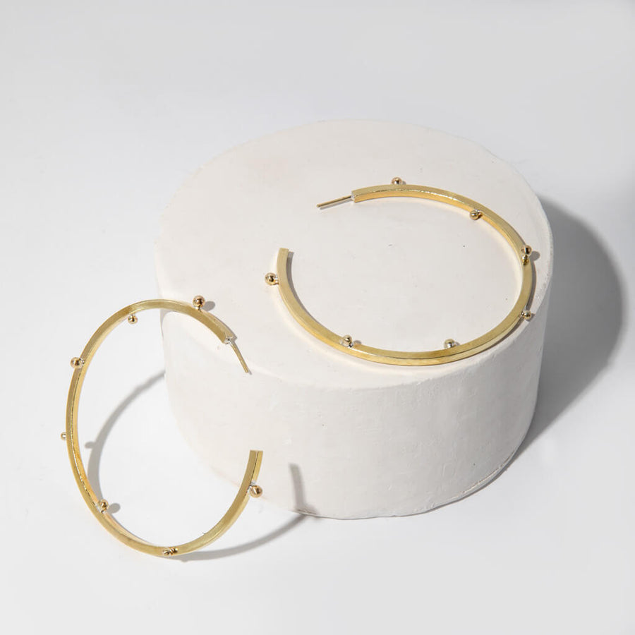Dramatic brass hoop earrings. Ethically made jewelry designed for the everyday.