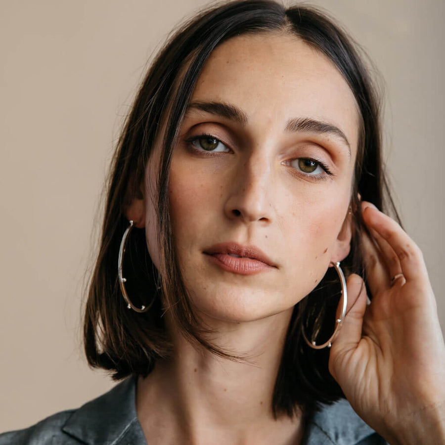 Sterling hoops that elevate any outfit. Modern jewelry that's made by hand.
