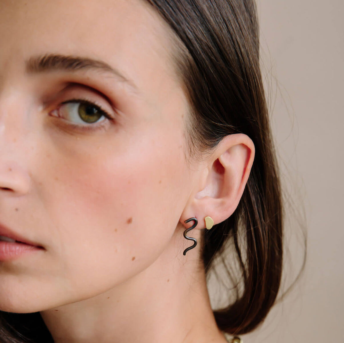 Tiny earrings that make a big statement. Handmade in mixed metals.