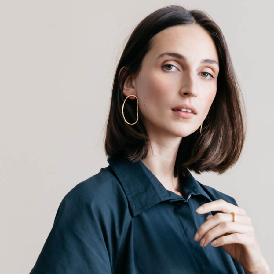 Organic pool shaped statement earrings in brass.