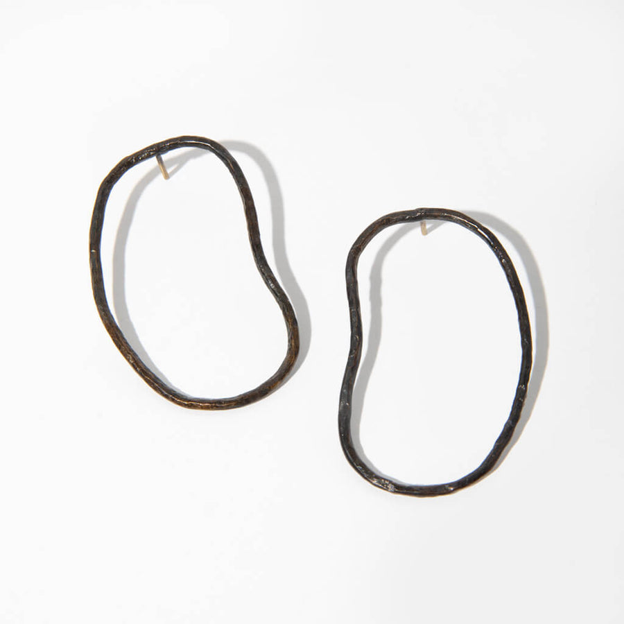 Elegant and slightly edgy, these organic pool shape earrings are a dramatic statement piece.