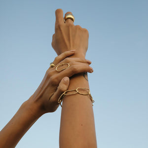 Elegant layers wrap you in warm brass. Ethically made jewelry by Mulxiply.