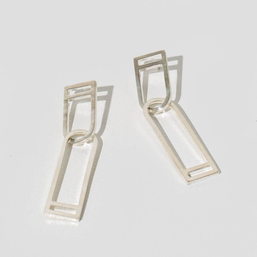 Strong and elegant sterling silver earrings by MULXIPLY.