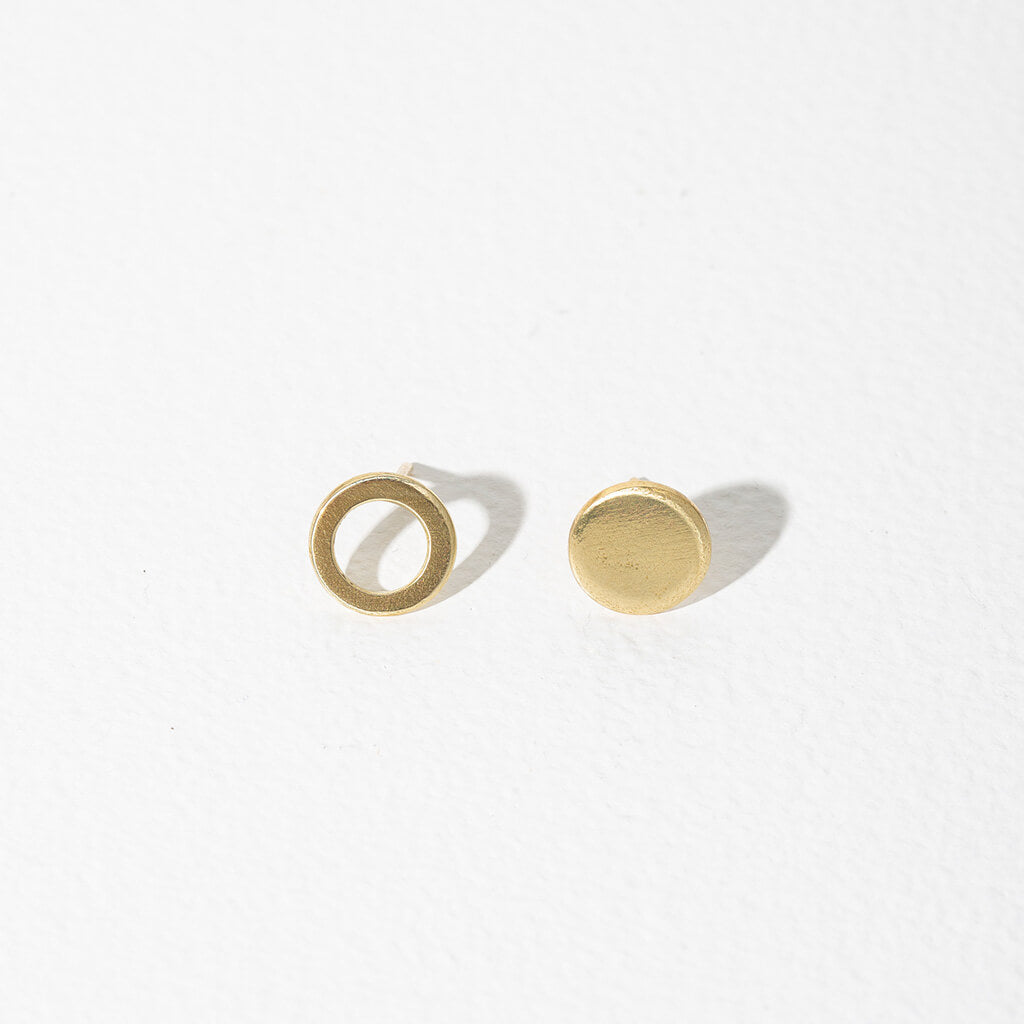 Our circle stud earrings are an ode to mismatched minimalism