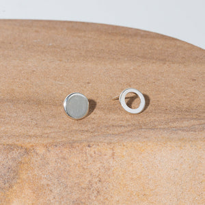 Our circle sterling silver stud earrings are an ode to mismatched minimalism