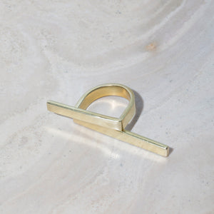 Modern geometric wrap ring in brass and sterling silver